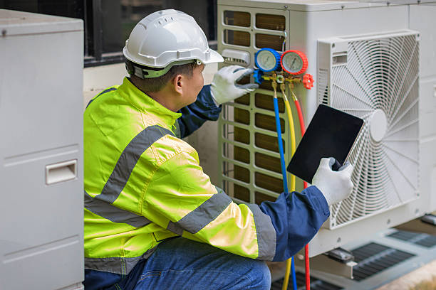 Professional Hvac technician working in Byfield, MA
